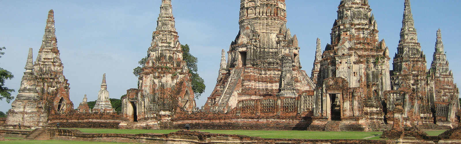 Well-preserved ruins of an ancient stone temple with many towers and spires.